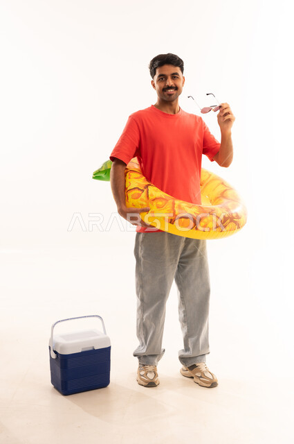 Saudi Man with Summer Vacation Gear in Studio