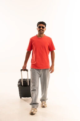 Arab Man Walking with Suitcase on White Background