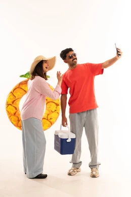 Arab Couple with Summer Vacation Gear Taking Selfie
