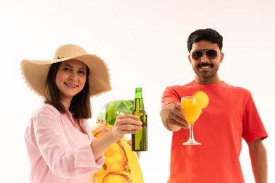 Man and Woman Toasting Summer Drinks on White Background