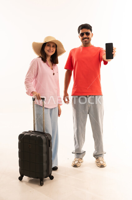 Arab Couple with Suitcase Holding Smartphone for Travel