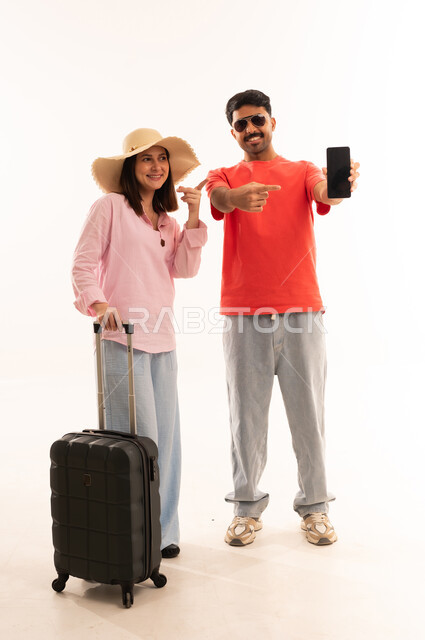 Arab Couple Travelers Holding Smartphone with Suitcase