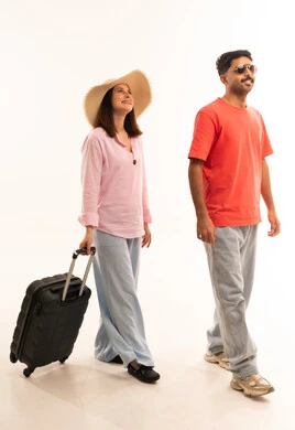 Arab Couple Walking with Suitcase on White Background