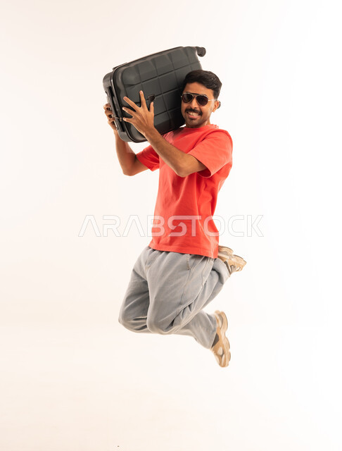 Man Jumping with Suitcase on White Background
