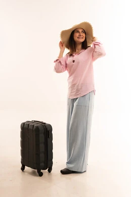 Arab Woman with Suitcase and Straw Hat in Studio