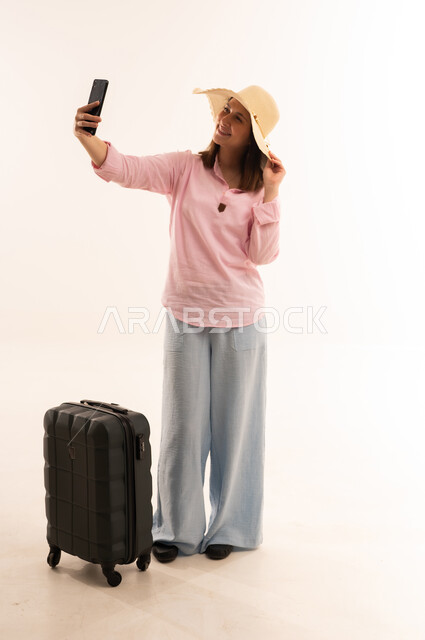 Woman Traveler with Suitcase Taking Selfie