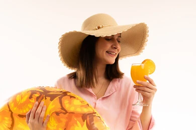 Woman with Sun Hat and Juice on White Background Woman with Sun Hat and Juice on White Background