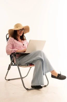 Woman with Laptop in Camping Chair White Background