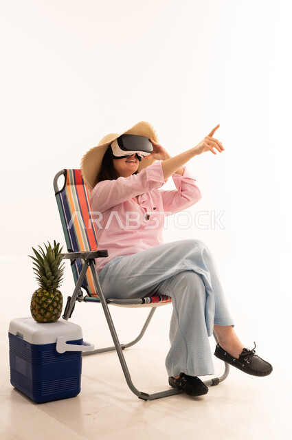 Woman in VR Headset Sitting on Beach Chair