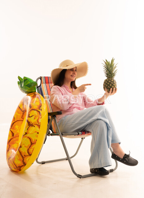 Arab Woman with Pineapple and Beach Gear White Background