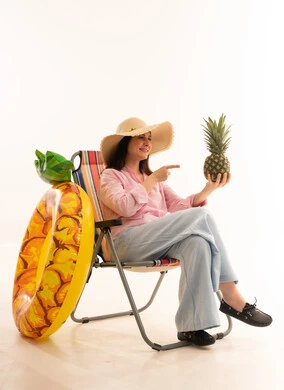 Arab Woman with Pineapple and Beach Gear White Background