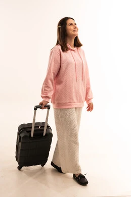 Woman with Suitcase Walking on White Background