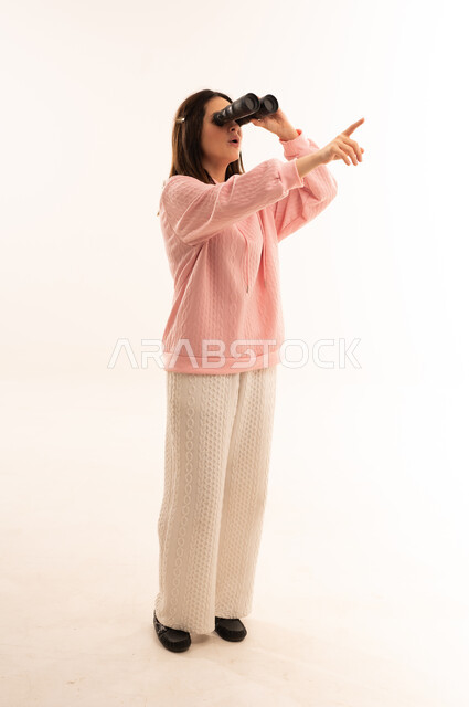 Arab Woman with Binoculars Pointing on White Background
