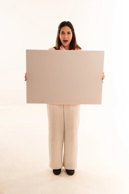 Arab Woman Holding Blank White Poster with Surprised Face