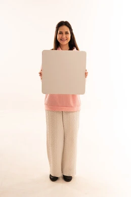 Smiling Arab Woman Holding Blank Signboard in Studio