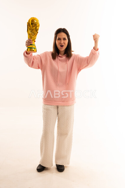 Woman Holding World Cup Trophy Celebrating in Studio
