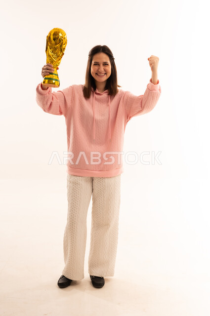 Woman Celebrating with Gold World Cup Trophy Studio