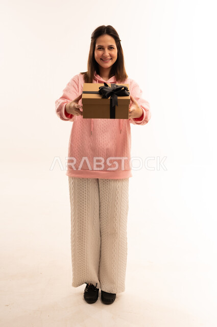 Arab Woman Holding Gift Box on White Background