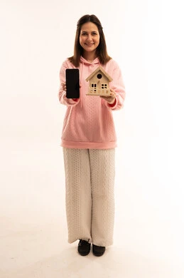 Arab Woman Holding House Model and Smartphone