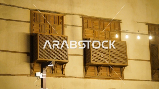 Traditional Wooden Mashrabiya Windows at Night