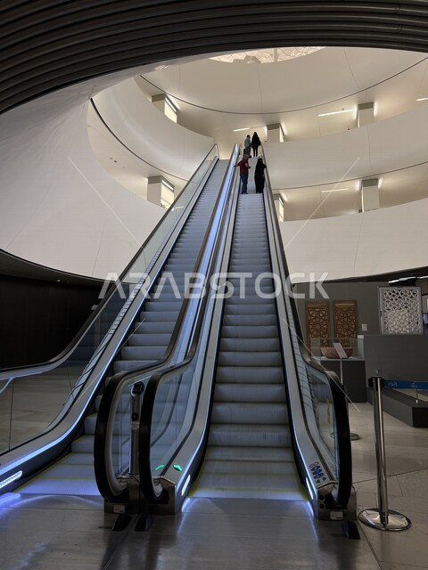 Creative image of the escalators inside the King Abdulaziz Center for World Culture (Ithra) in the city of Dhahran, Saudi Arabia, the architectural art, the beauty of the King Abdulaziz Center building, cultural landmarks, escalator