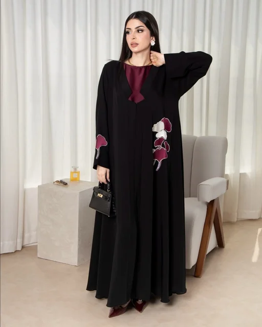 Saudi Woman in Modern Black Abaya with Handbag