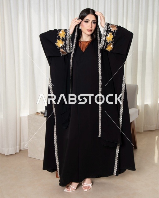 Saudi Woman in Modern Black Abaya with Gold Embroidery