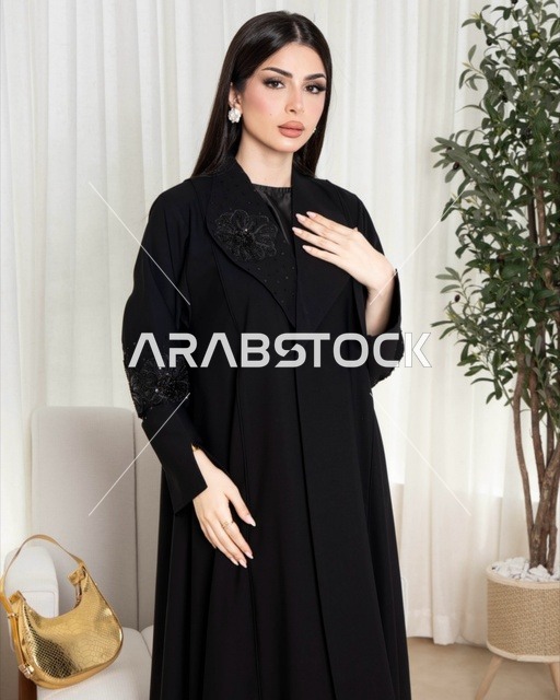 Saudi Woman in Modern Black Abaya Indoors