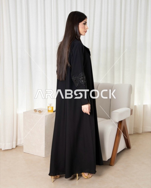 Saudi Woman in Modern Black Abaya Indoor Fashion