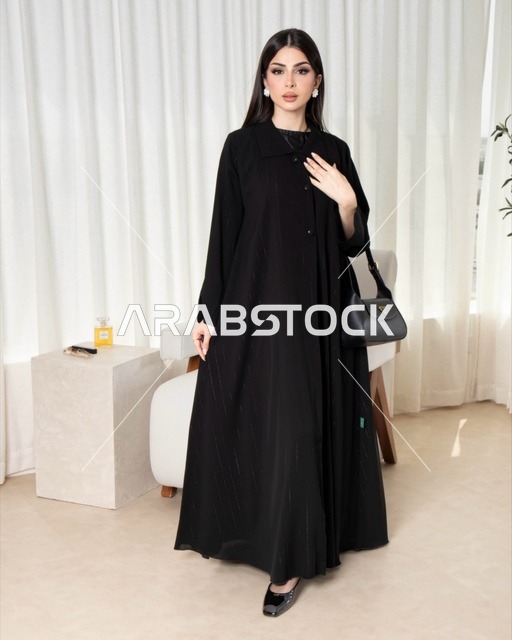 Saudi Woman in Modern Black Abaya with Handbag