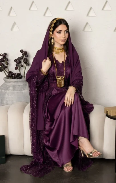 Saudi Woman in Purple Jalabiya and Gold Jewelry