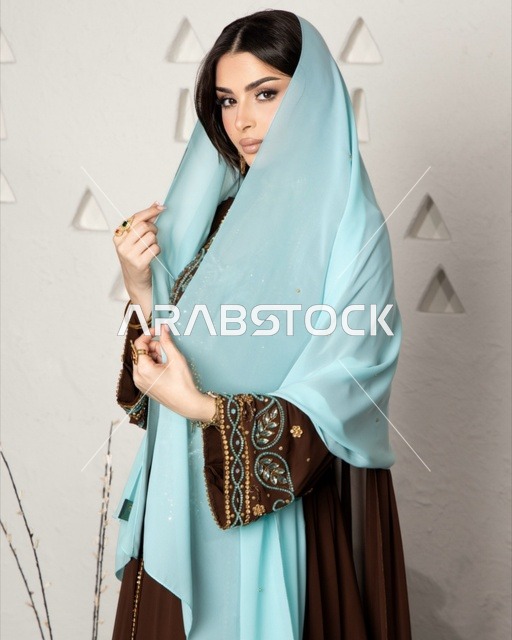 Saudi Woman in Modern Abaya and Blue Sheila