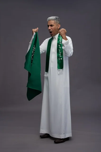 Saudi Man Holding National Flag Cheering in Studio