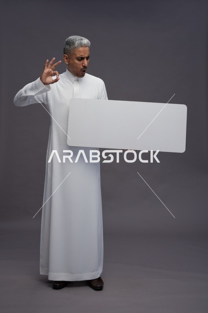 Saudi Man with Blank White Sign Board Studio Shot