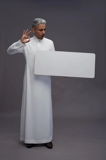 Saudi Man with Blank White Sign Board Studio Shot
