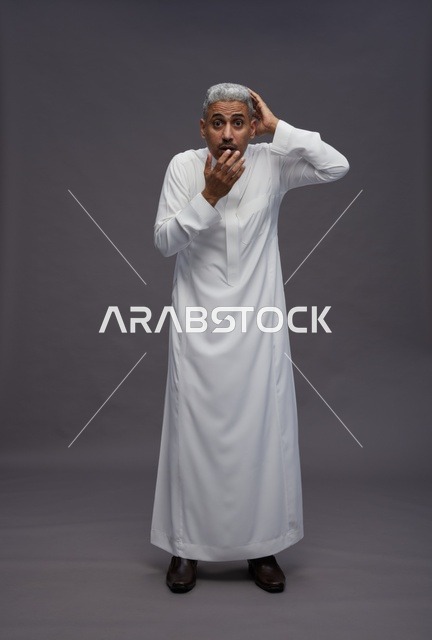 Shocked Saudi Man in White Thobe on Grey Background