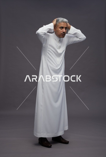 Shocked Saudi Man in White Thobe Studio Portrait