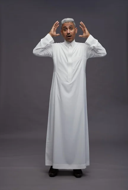 Shocked Saudi Man in White Thobe on Grey Background
