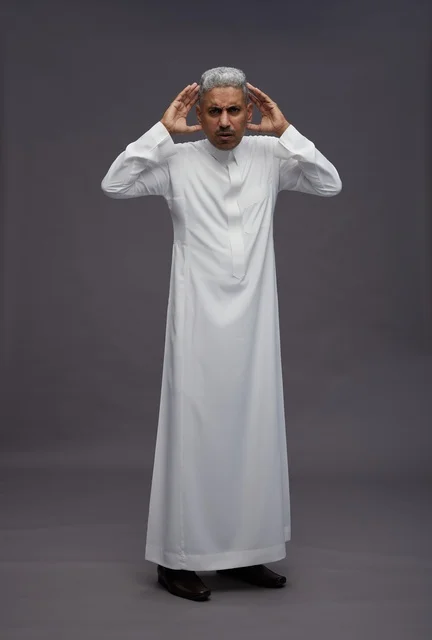 Saudi Man in White Thobe with Confused Expression