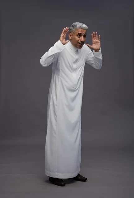 Saudi Man in White Thobe with Surprised Gesture