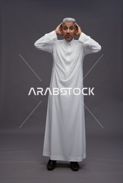 Surprised Arab Man in White Thobe Studio Shot