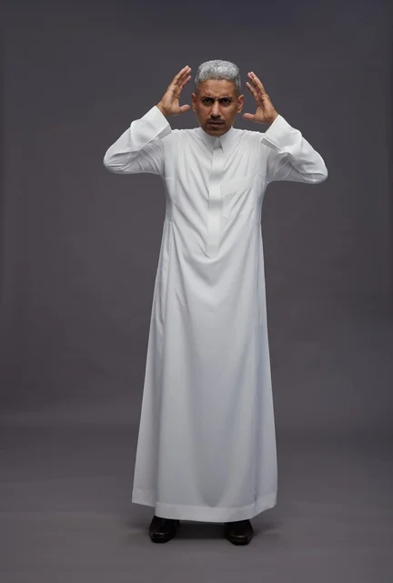 Saudi Man in White Thobe with Confused Expression