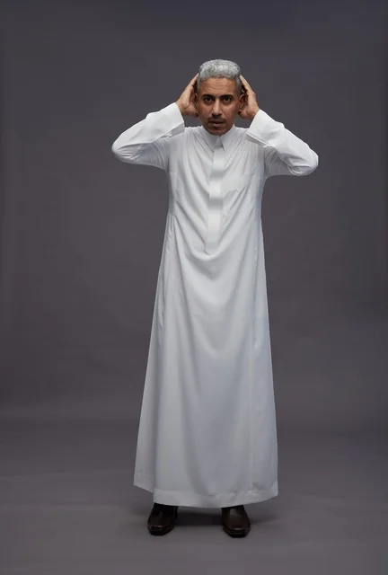 Saudi Man in White Thobe on Grey Background Studio