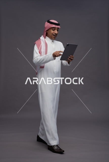 Saudi Man Using Digital Tablet in Studio