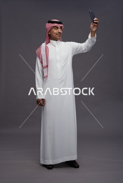 Saudi Man Taking Selfie in Traditional Dress