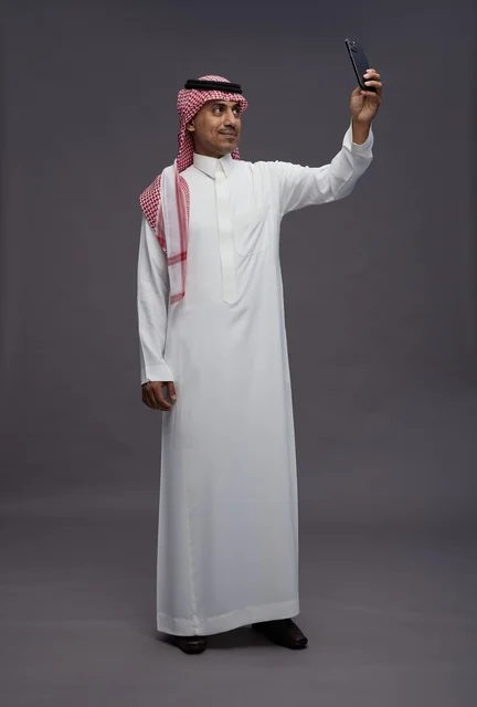 Saudi Man Taking Selfie in Traditional Dress