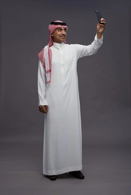 Saudi Man Taking Selfie in Studio Setting