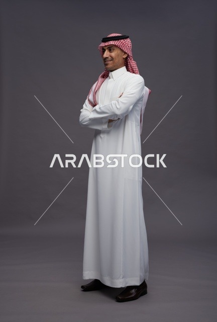 Saudi Man in Traditional Thobe on Grey Background