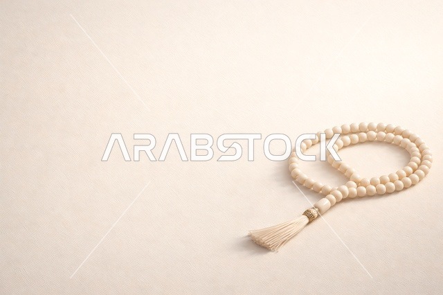 Islamic Prayer Beads on Minimalist Beige Background
