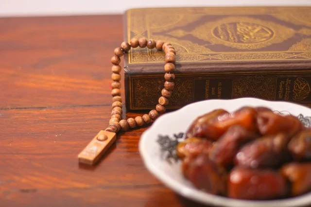 Quran and Dates on Wooden Table for Ramadan